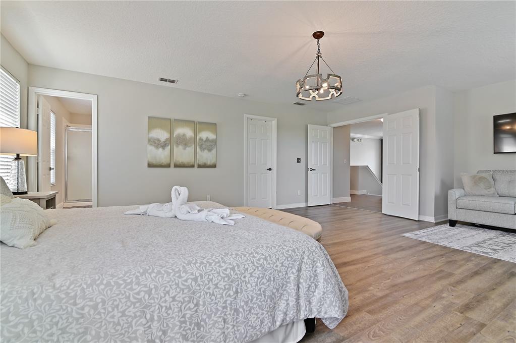 701 Kettering Road Davenport, FL 33897 - Photo 19 of 41 a bedroom with a bed and a couch