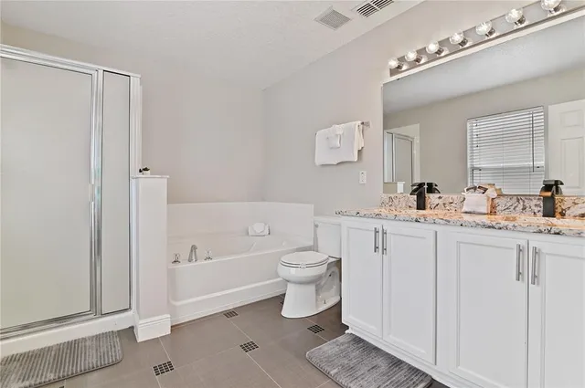 a bathroom with a toilet a sink and a bathtub