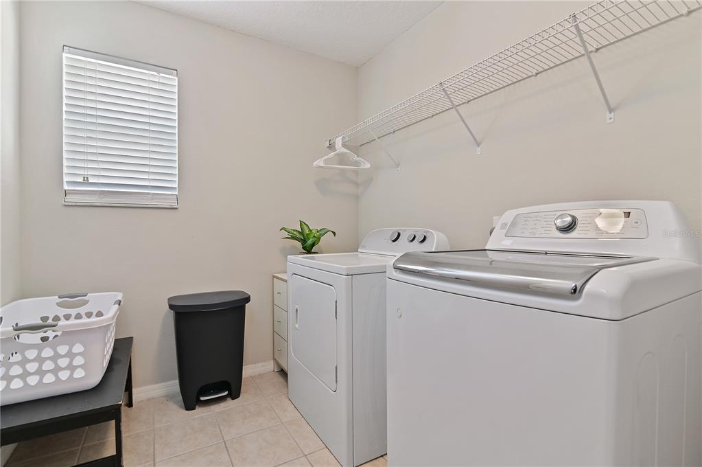 701 Kettering Road Davenport, FL 33897 - Photo 23 of 41 a utility room with dryer and washer