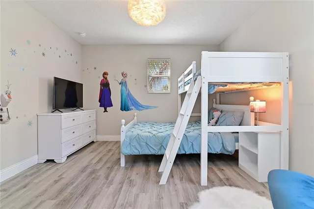 a living room with furniture and flat screen tv