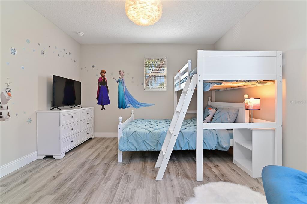 701 Kettering Road Davenport, FL 33897 - Photo 24 of 41 a living room with furniture and flat screen tv
