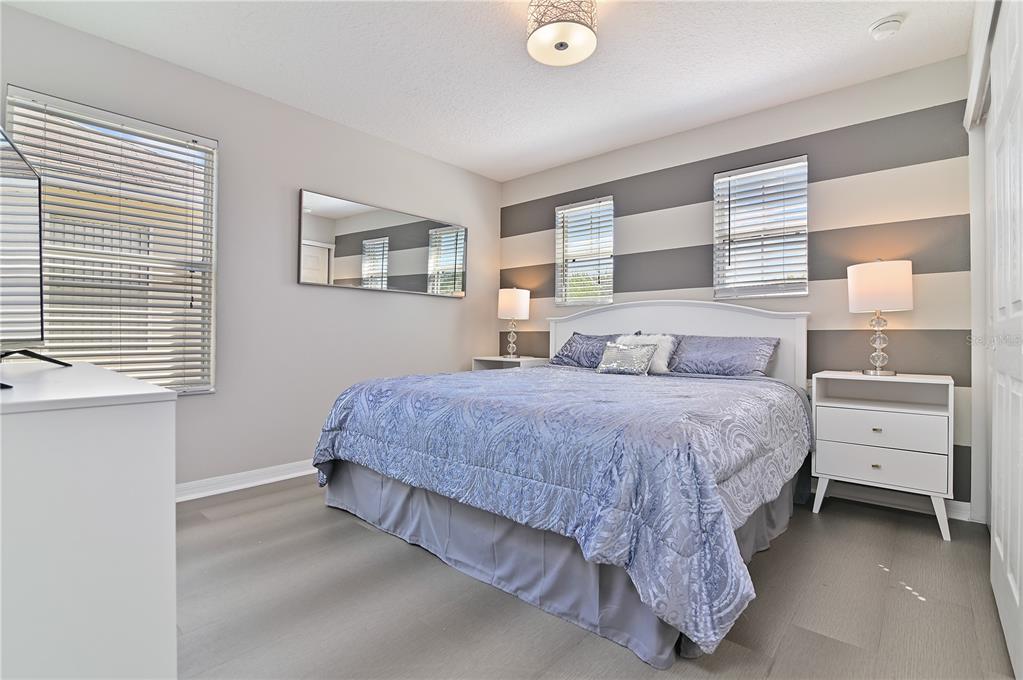 701 Kettering Road Davenport, FL 33897 - Photo 27 of 41 a bedroom with a bed and a window