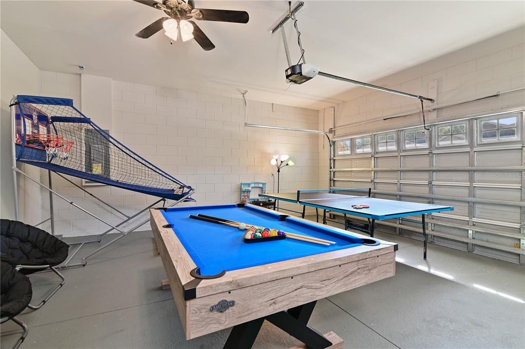 701 Kettering Road Davenport, FL 33897 - Photo 29 of 41 a room with pool table and windows