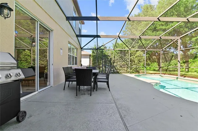 a dining room with furniture and a window