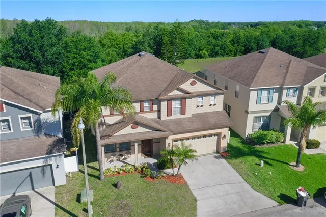a aerial view of a house with a yard