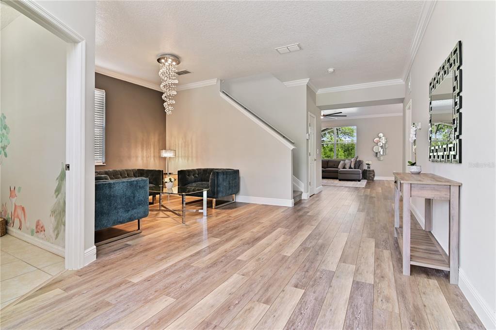 701 Kettering Road Davenport, FL 33897 - Photo 4 of 41 a living room with furniture and a wooden floor