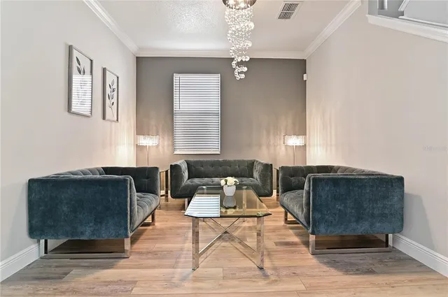 a living room with furniture and a mirror