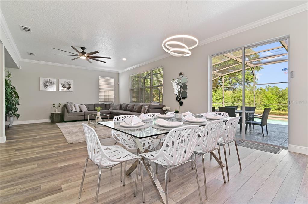 701 Kettering Road Davenport, FL 33897 - Photo 9 of 41 a view of a dining room with furniture window and wooden floor