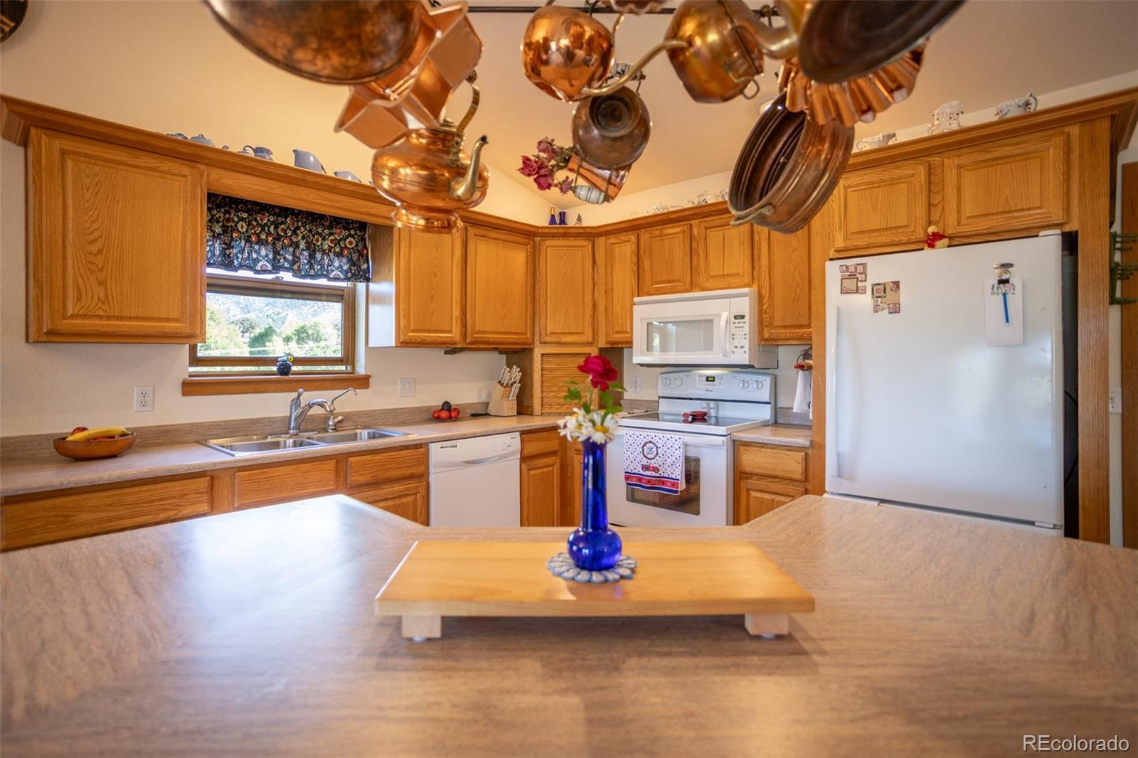 7280 County Road 178 Salida, CO 81201 - Photo 20 of 39 a kitchen with stainless steel appliances granite countertop a refrigerator and a stove