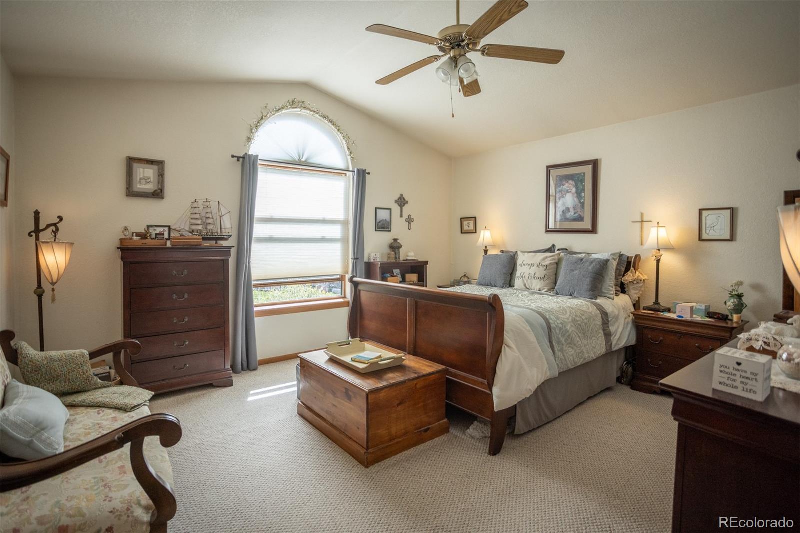 7280 County Road 178 Salida, CO 81201 - Photo 23 of 39 a spacious bedroom with a bed and wooden floor