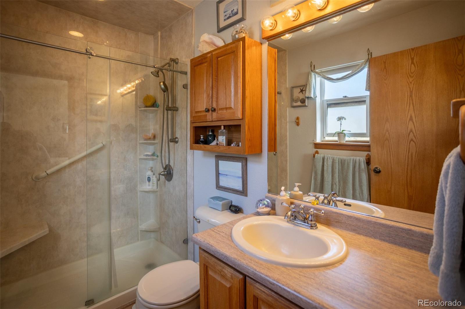 7280 County Road 178 Salida, CO 81201 - Photo 26 of 39 a bathroom with a sink toilet and shower