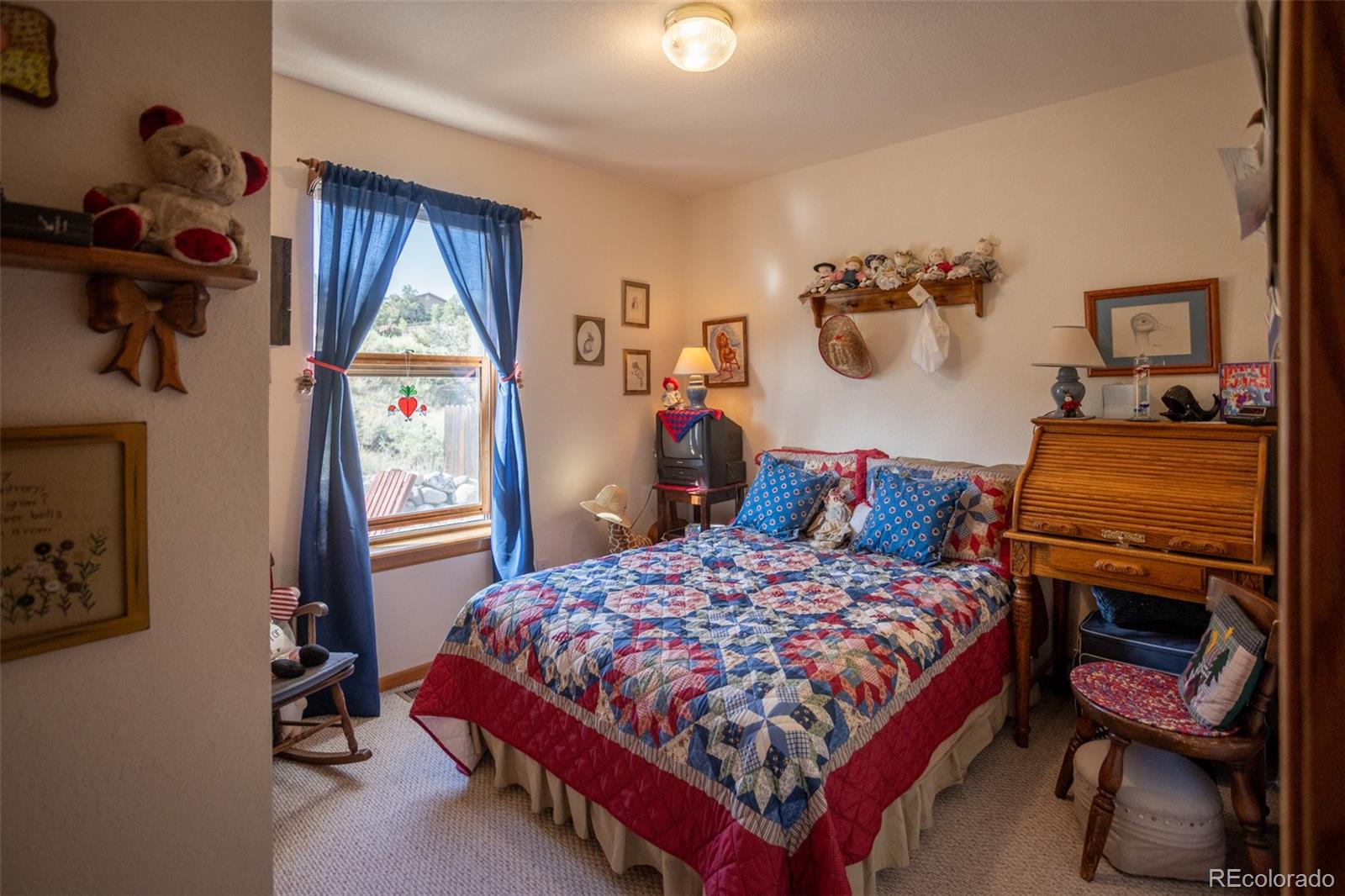 7280 County Road 178 Salida, CO 81201 - Photo 30 of 39 a bedroom with a bed and wooden floor