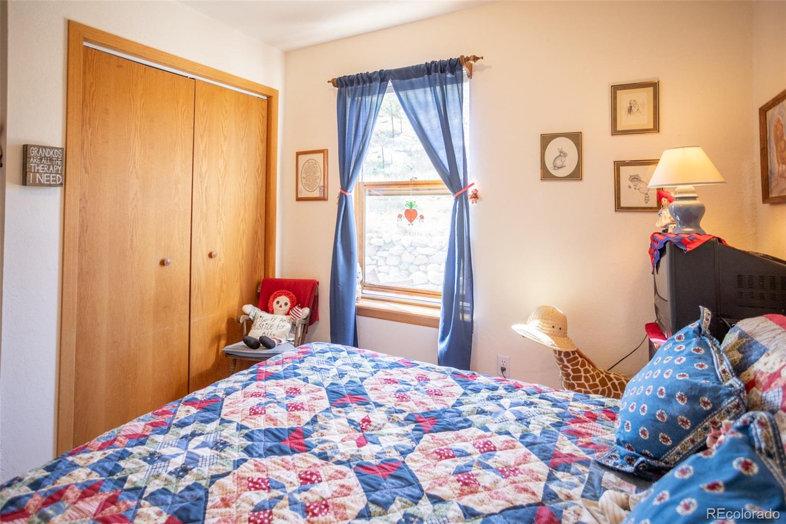 7280 County Road 178 Salida, CO 81201 - Photo 31 of 39 a bedroom with a bed and a window