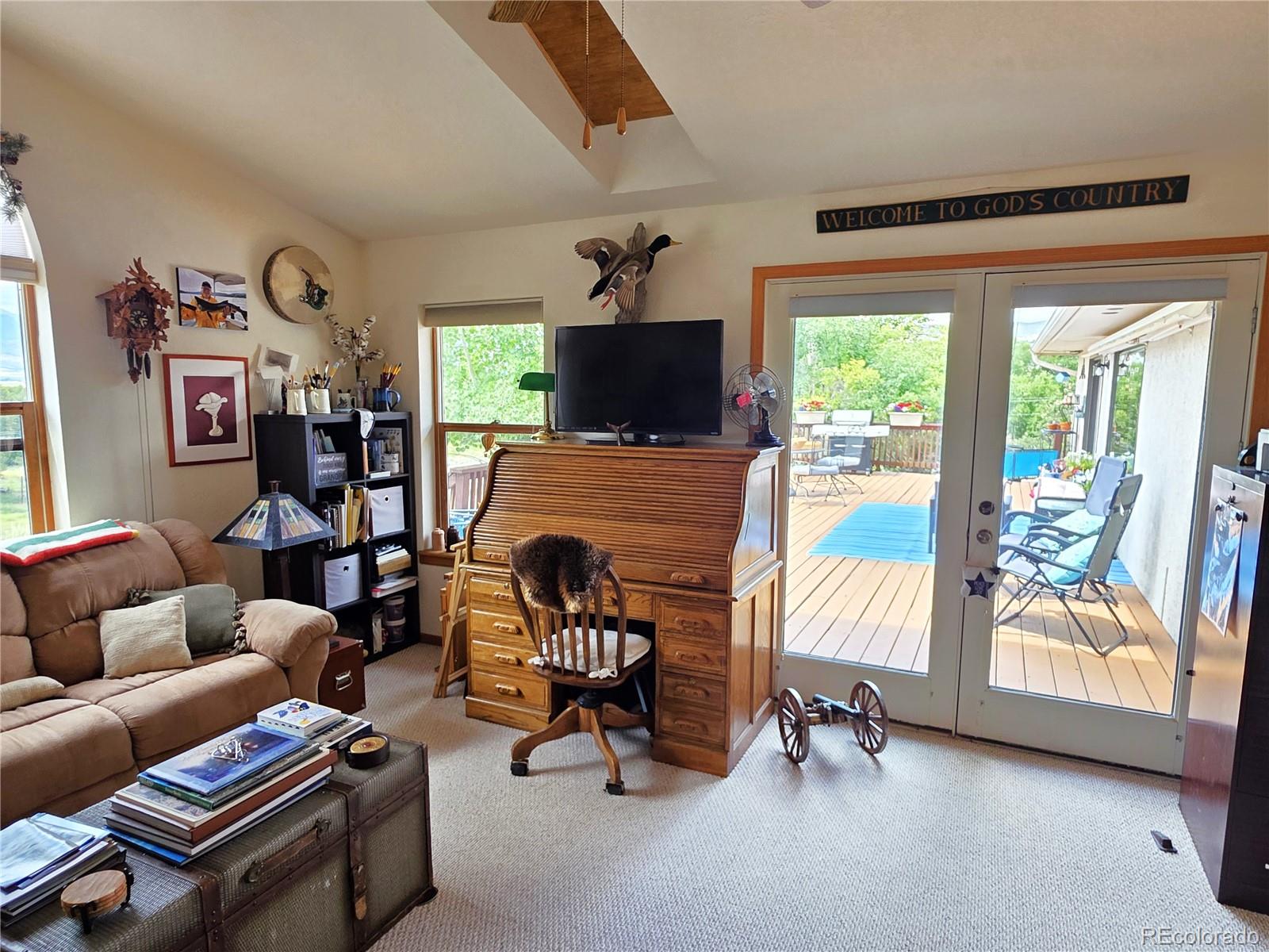 7280 County Road 178 Salida, CO 81201 - Photo 32 of 39 a living room with furniture and a flat screen tv
