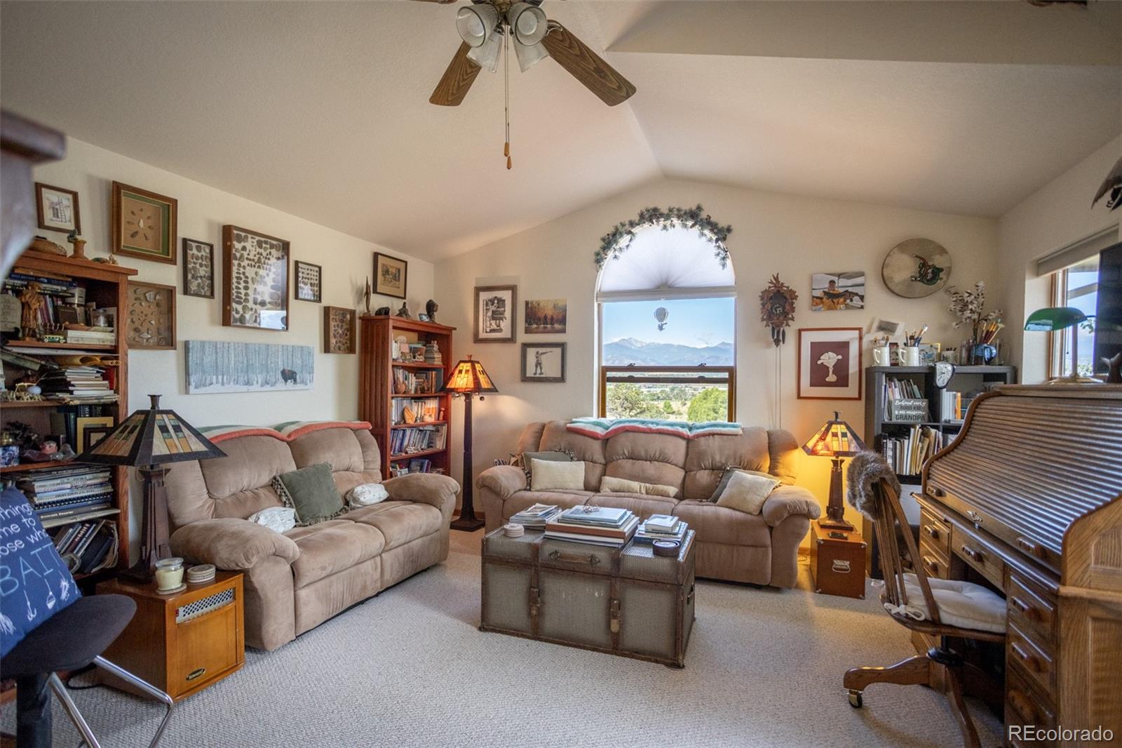 7280 County Road 178 Salida, CO 81201 - Photo 33 of 39 a living room with furniture fireplace and a ceiling fan