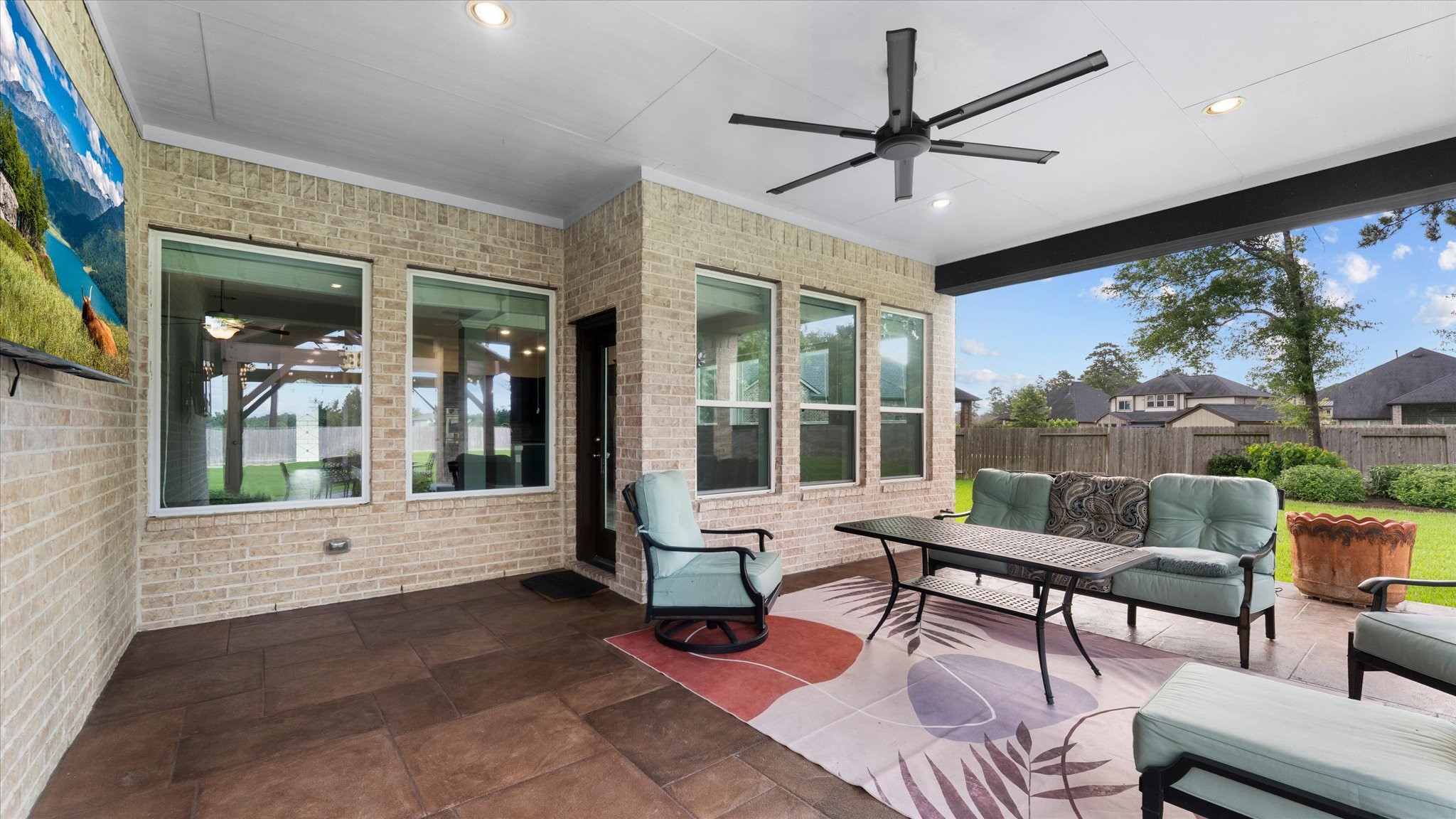 32001 Birch Briar Court Spring, TX 77386 - Photo 43 of 48 Covered outdoor living area with vaulted wood ceiling, ceiling fan, and seamless access to the backyard, perfect for year-round entertaining. Wired and plumbed for the outdoor kitchen of your dreams.