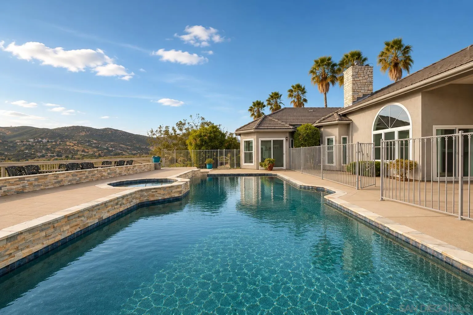10015 El Capitan Real Road El Cajon, CA 92021 - Photo 42 of 58 a view of a house with swimming pool and a yard