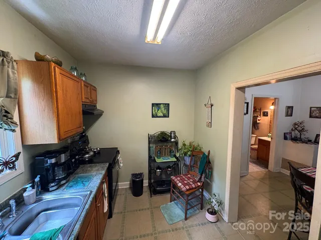 a room with furniture a rug and a window