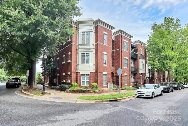 a view of street with parked cars