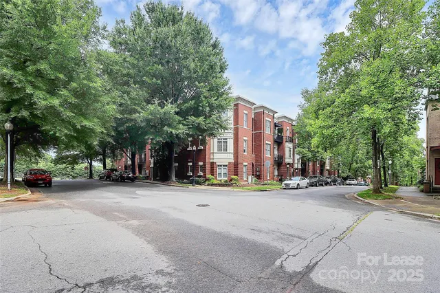 a view of a parked cars in front of a building