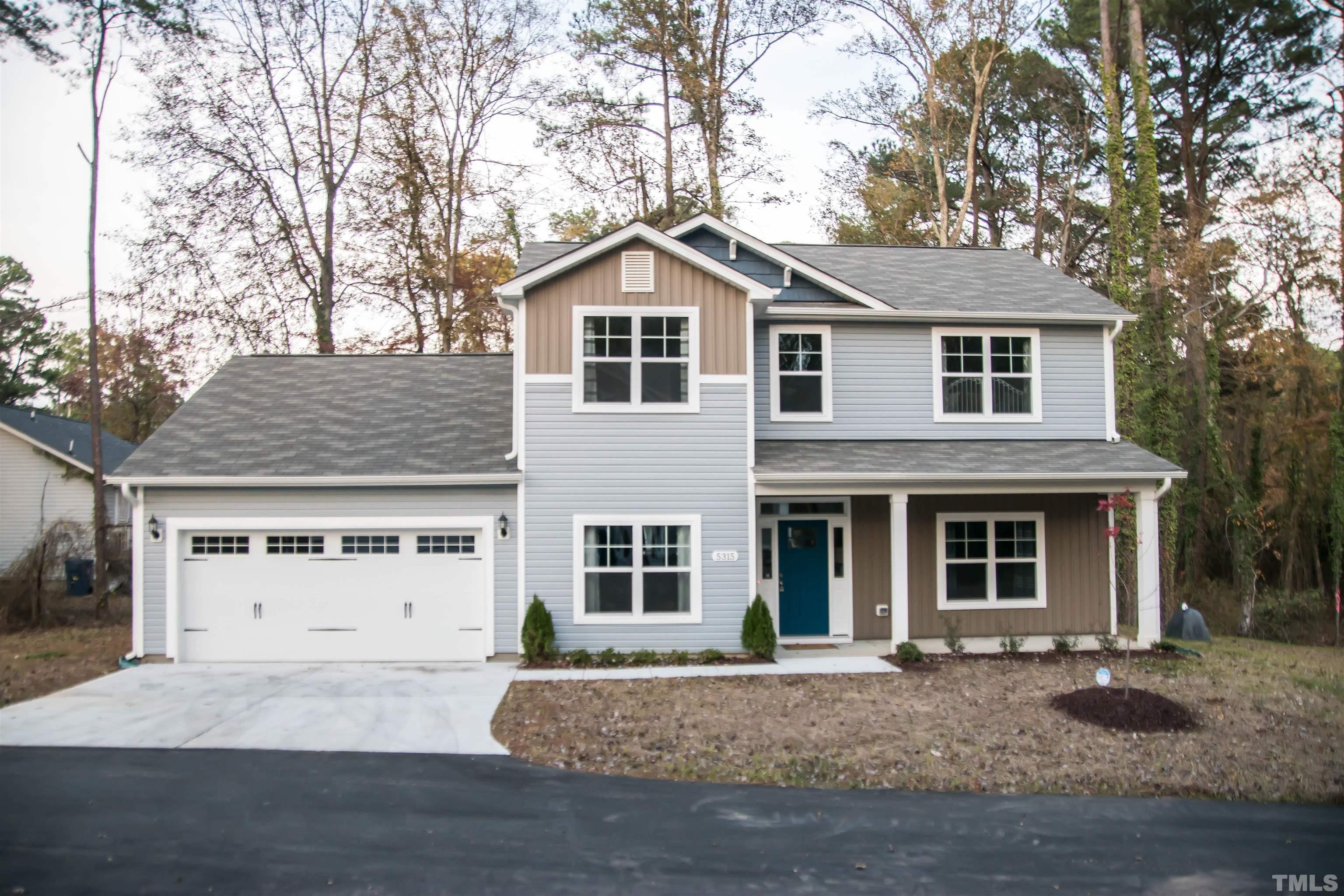 5315 Fayetteville Road Durham, NC 27713 - Photo 1 of 36 a front view of a house with a yard and garage