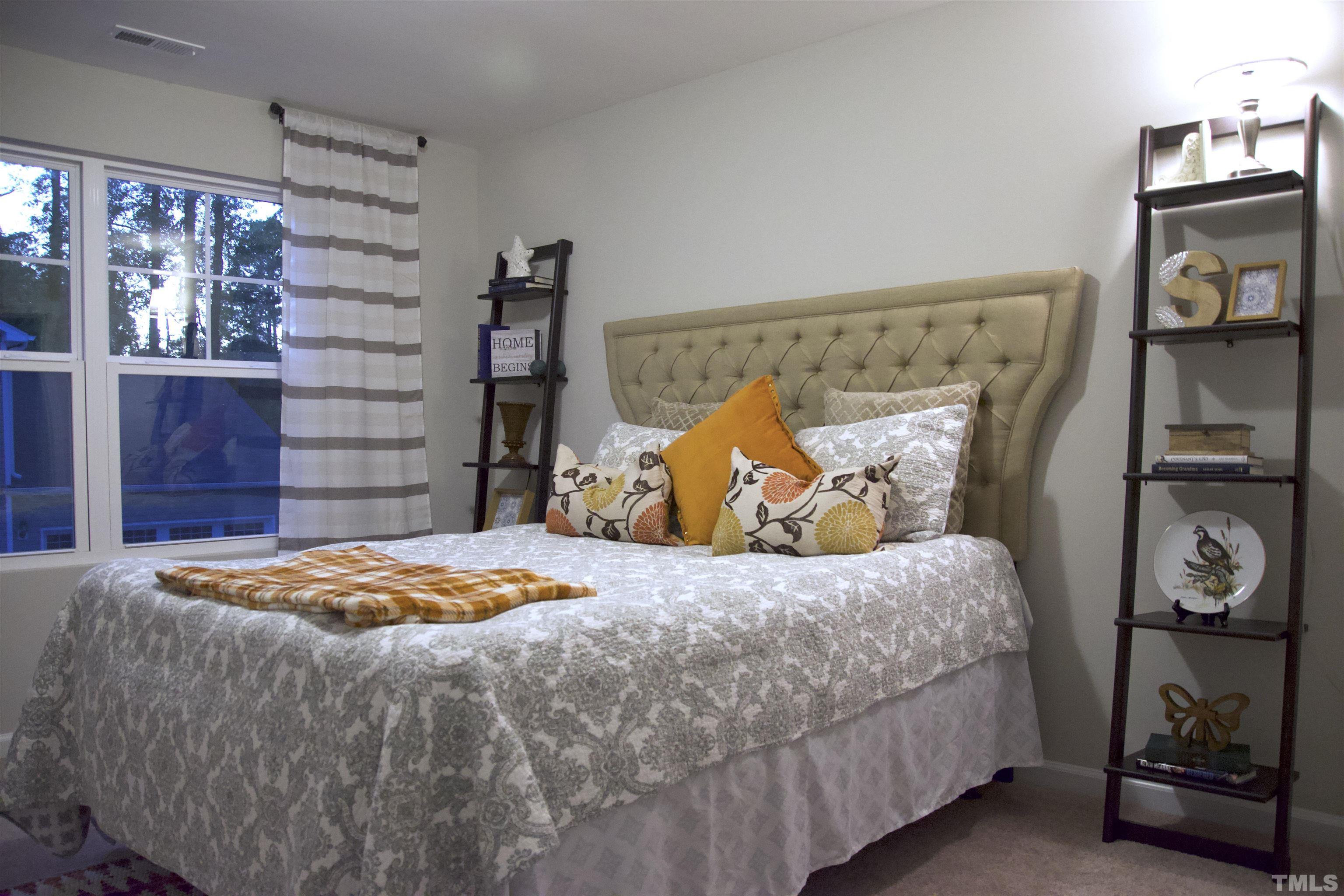 5315 Fayetteville Road Durham, NC 27713 - Photo 21 of 36 a bedroom with a bed and a closet