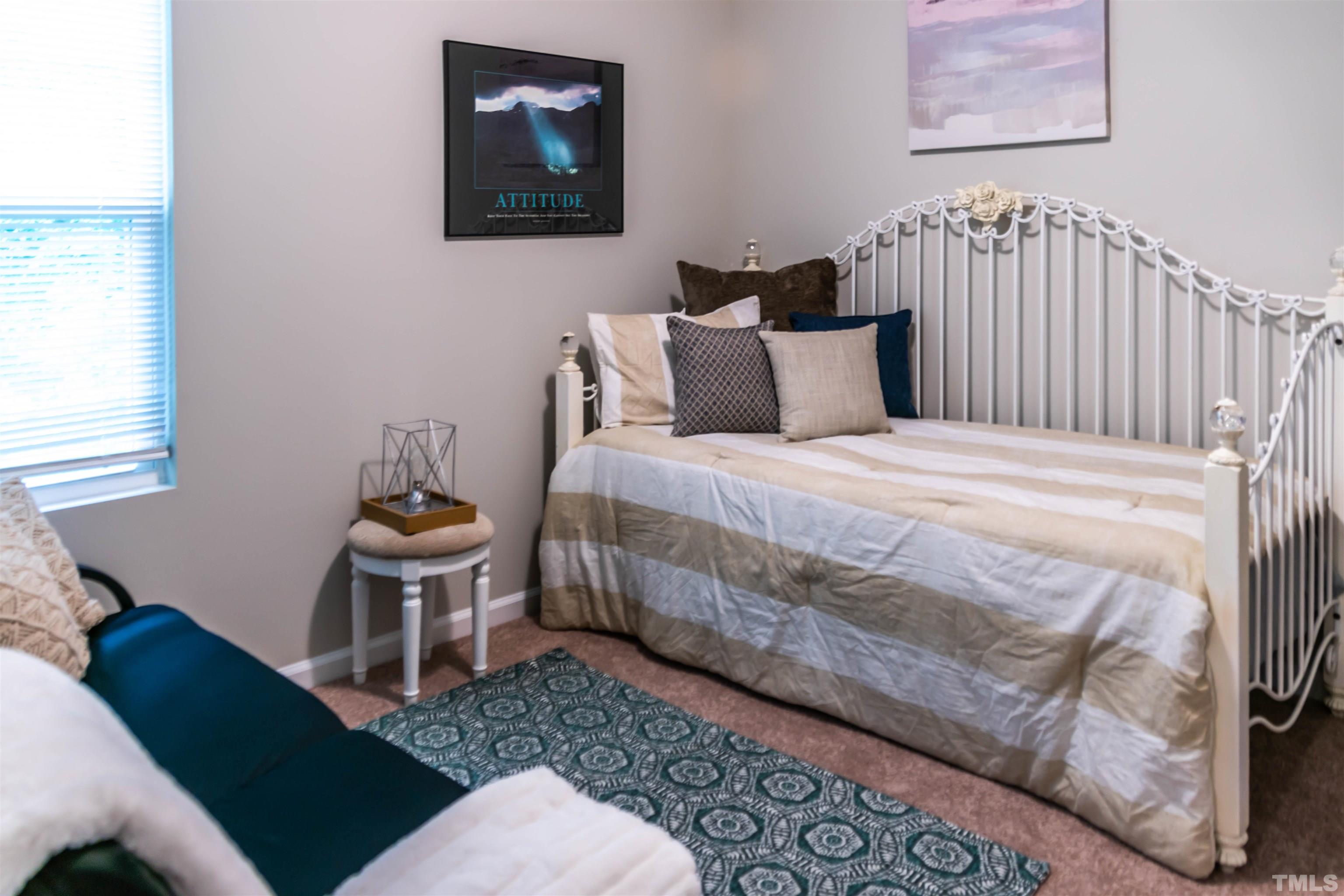 5315 Fayetteville Road Durham, NC 27713 - Photo 24 of 36 a bedroom with a bed and wooden floor
