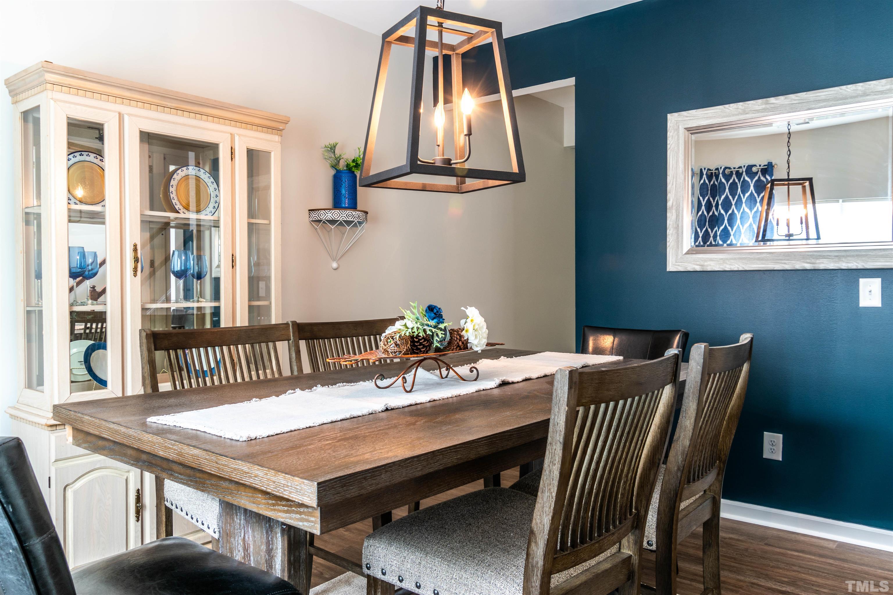 5315 Fayetteville Road Durham, NC 27713 - Photo 7 of 36 a view of a dining room with furniture and wooden floor
