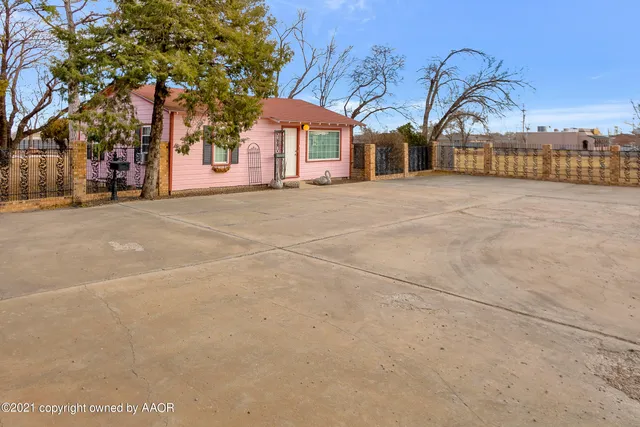 a view of a building with a yard