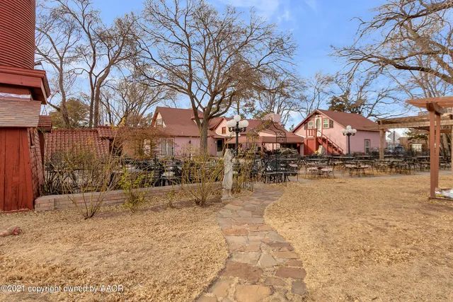 a view of a living room with furniture and a window