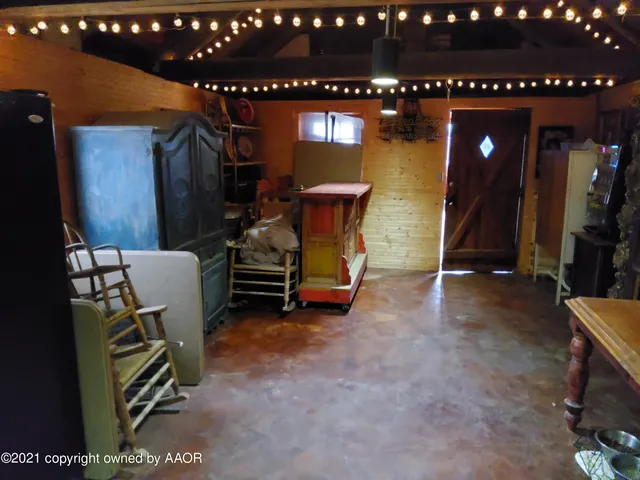 a bedroom with a bed and a tv