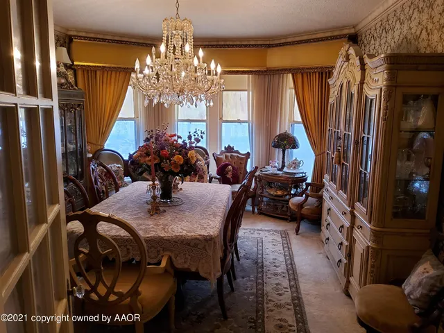 a bedroom with a bed window and a flat screen tv