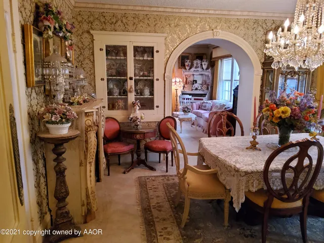 a bedroom with a bed and a mirror