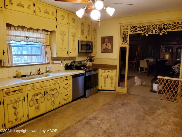 a view of a livingroom with furniture and a flat screen tv
