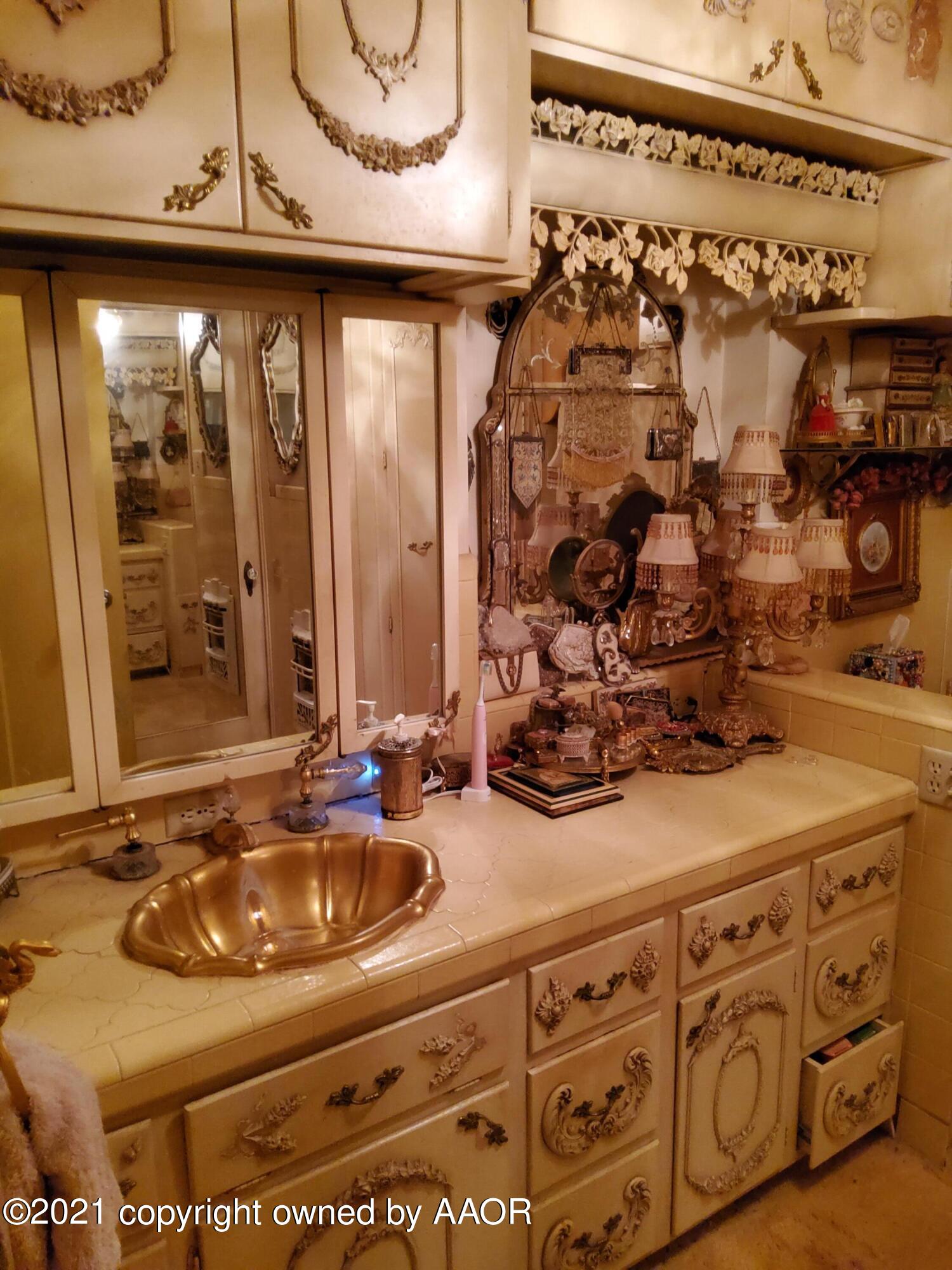 2501 South Grand Street Amarillo, TX 79103 - Photo 47 of 80 a bathroom with a sink and a mirror