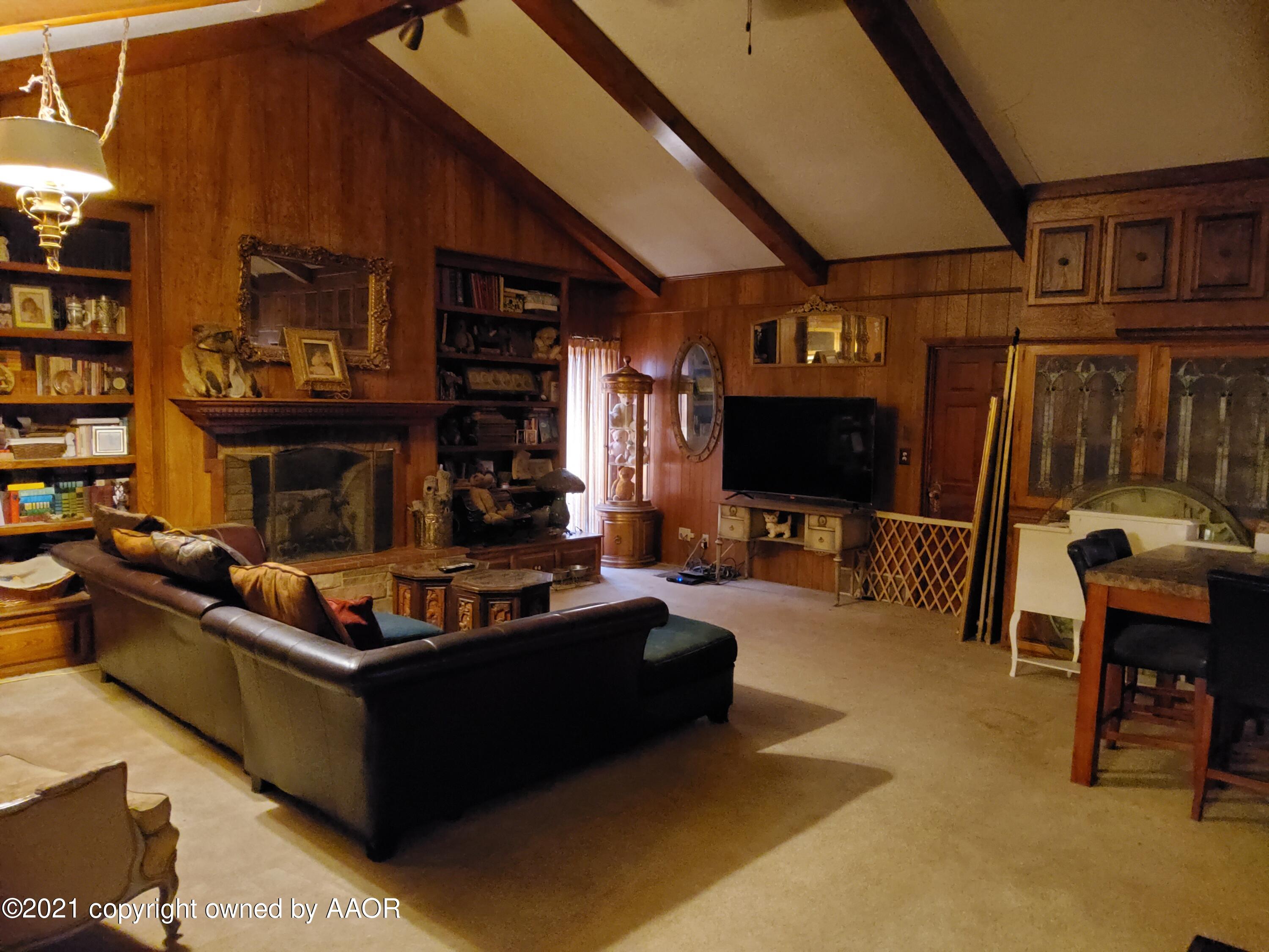 2501 South Grand Street Amarillo, TX 79103 - Photo 67 of 80 a living room with fireplace furniture and a flat screen tv