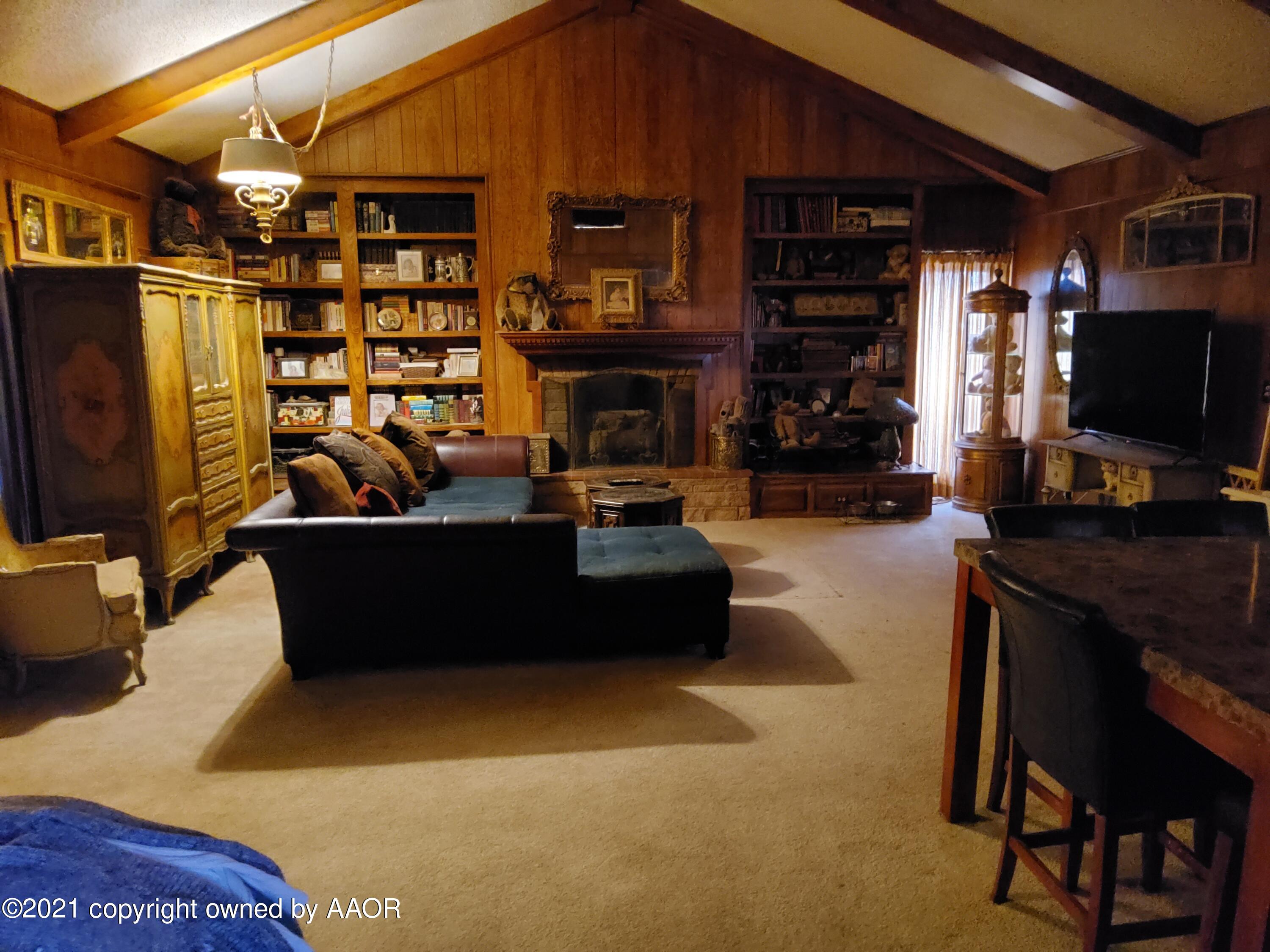 2501 South Grand Street Amarillo, TX 79103 - Photo 69 of 80 a living room with fireplace furniture and a flat screen tv