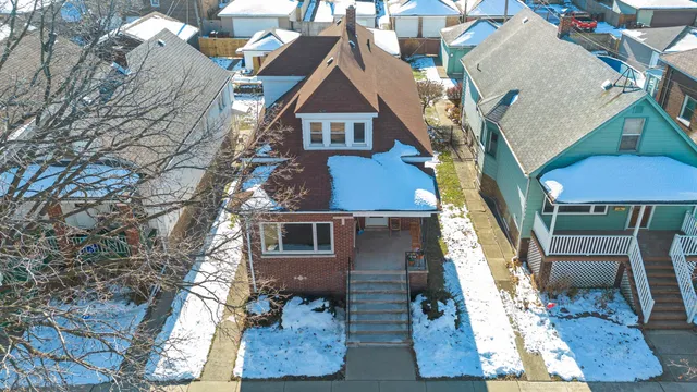 an aerial view of houses with yard