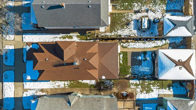 an aerial view of a house with yard swimming pool and outdoor seating