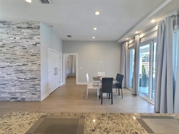 a view of a livingroom with furniture window and wooden floor