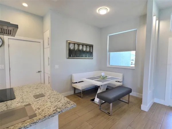 a workspace with furniture and a wooden floor
