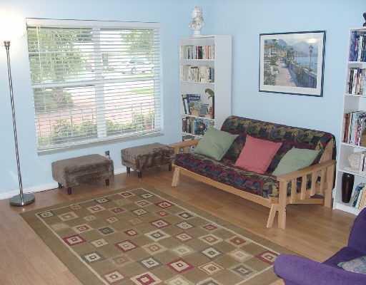124 Northwest 10th Street Boca Raton, FL 33432 - Photo 12 of 16 a bedroom with furniture and a large window