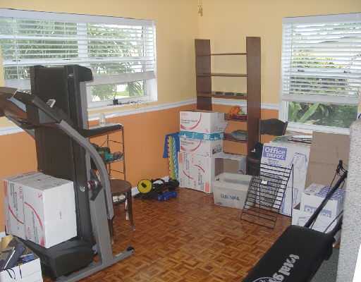 124 Northwest 10th Street Boca Raton, FL 33432 - Photo 13 of 16 a view of a bedroom with a large window