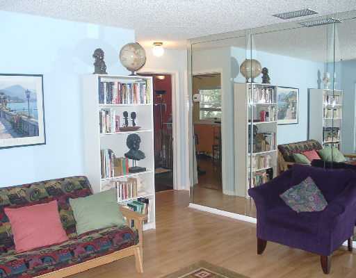 124 Northwest 10th Street Boca Raton, FL 33432 - Photo 15 of 16 a living room with furniture and a book shelf