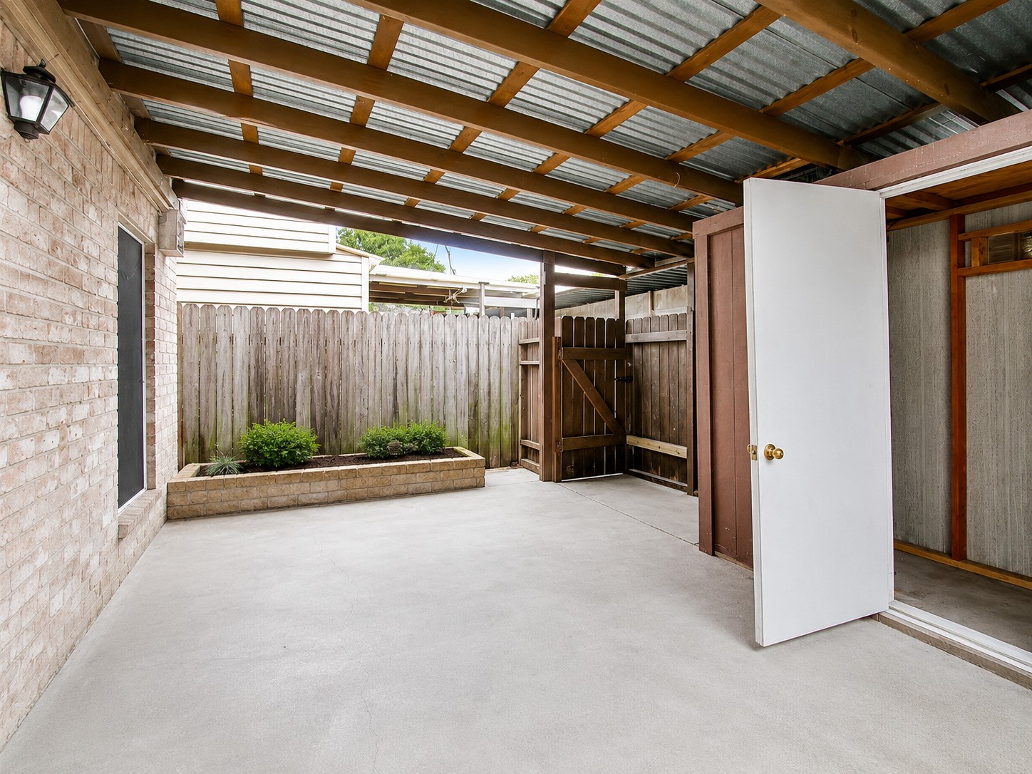 1607 Alabama Street, Unit 5 Pasadena, TX 77503 - Photo 16 of 16 Staged covered patio
