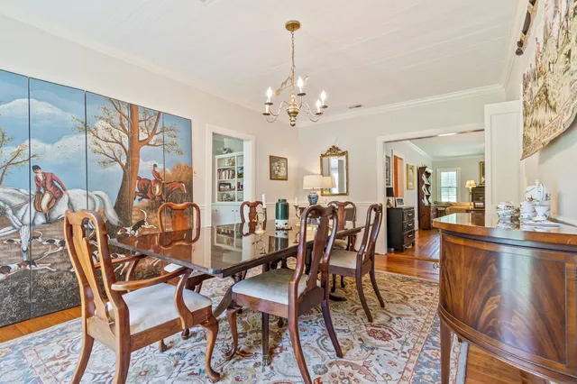 a kitchen with kitchen island granite countertop a sink cabinets and stainless steel appliances
