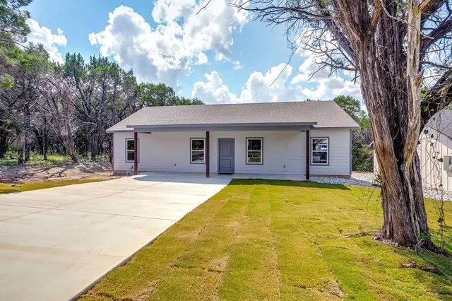 a house with swimming pool in front of it