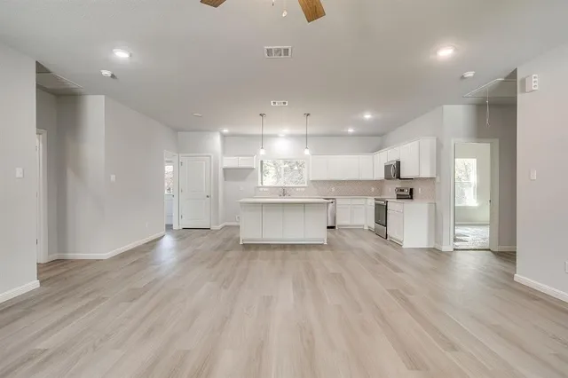 a view of an empty room with a window