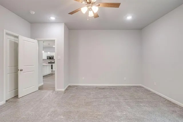 a spacious bathroom with a double vanity sink mirror and bathtub
