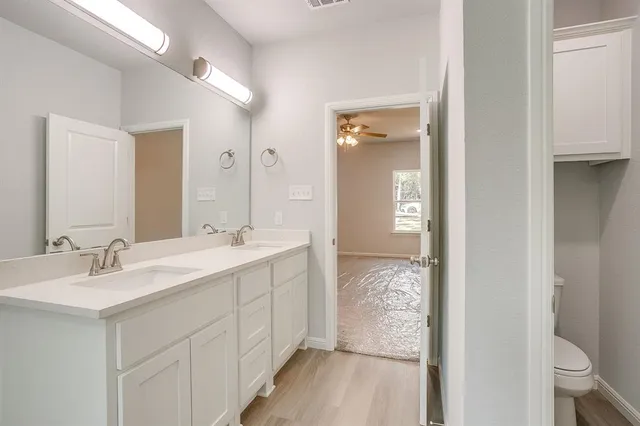 a white bath tub sitting next to a shower